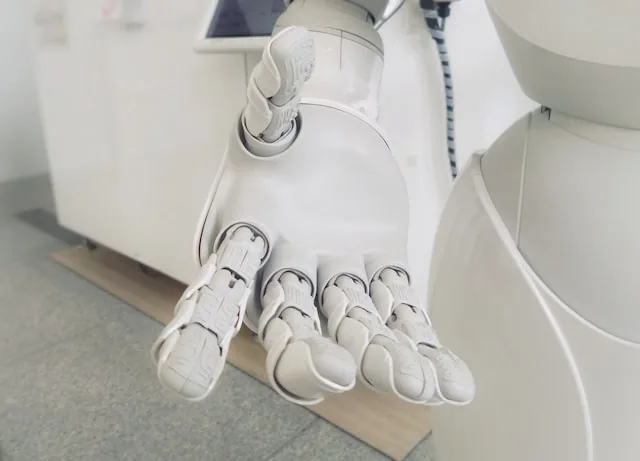 Main tendue d'un robot pour symboliser l'IA